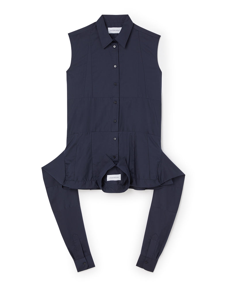 Sleeveless navy blouse featuring classic button-down front, sharp collar, and unique attached long back panels.