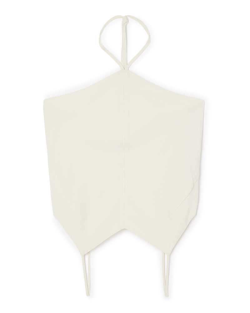 Ivory halter top with sleek lines and minimalist design, featuring thin straps and a pointed hem for a modern look.