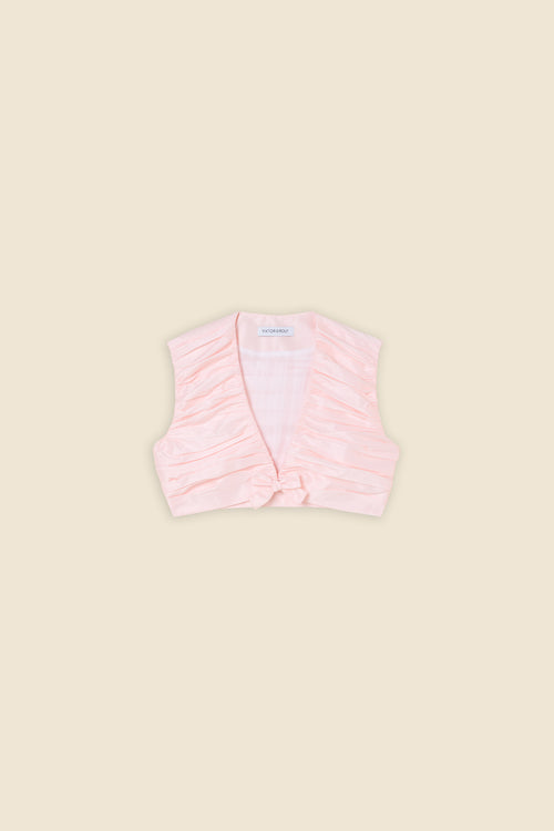 The meticulously placed pleats and silk-blend taffeta define the elegance of the top, reflecting classic haute couture craftsmanship with a modern edge