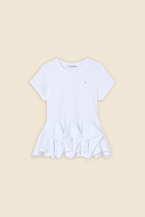 The craftmanship of the top reinterprets classic haute couture tuck ups into a modern silhouette
