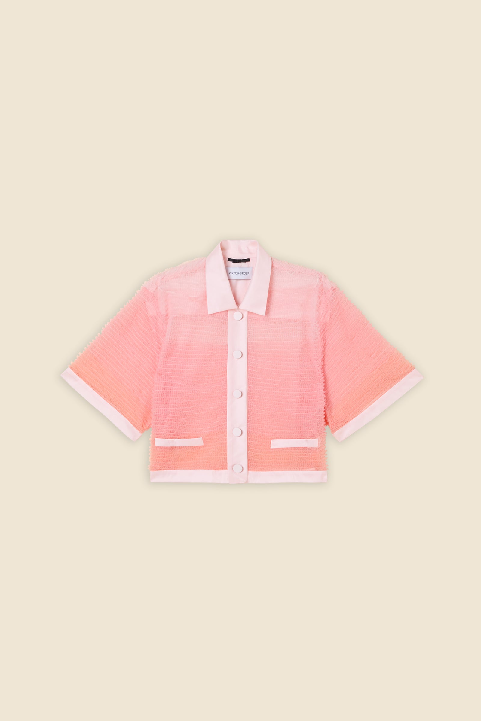 Inspired by the tulle from the ‘late stage capitalism waltz’ haute couture collection, the shirt features hand crafted tulle ruffles for a feminine texture