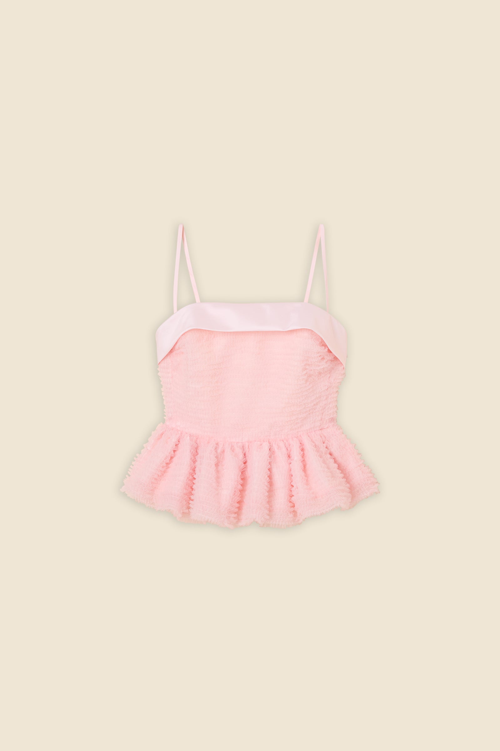 Inspired by the tulle from the ‘late stage capitalism waltz’ haute couture collection, the top features hand crafted tulle ruffles for a feminine texture