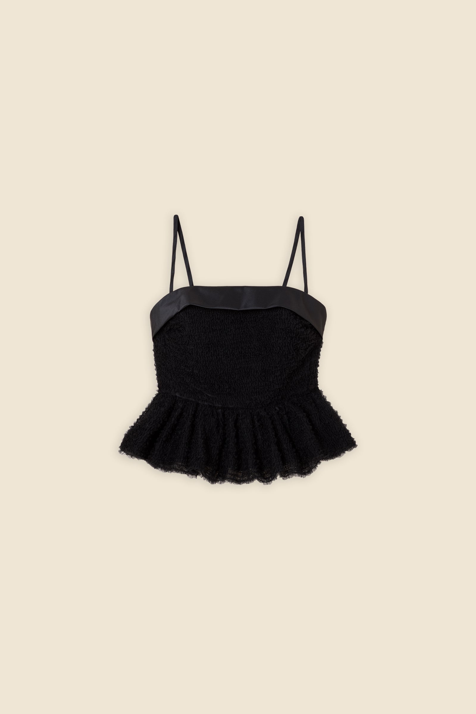 Inspired by the tulle from the ‘late stage capitalism waltz’ haute couture collection, the top features hand crafted tulle ruffles for a feminine texture