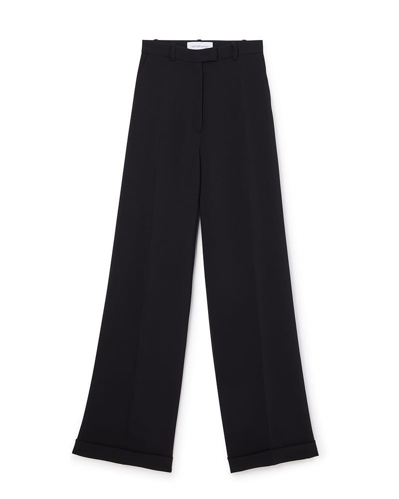 Wide-leg black tailored trousers with a high waist, featuring sharp pleats and a sleek waistband for a sophisticated silhouette.