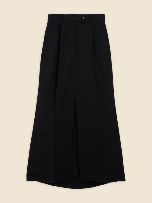 Black high-waisted trousers featuring a wide-leg design with pleated details, crafted from smooth wool fabric for a sleek finish.
