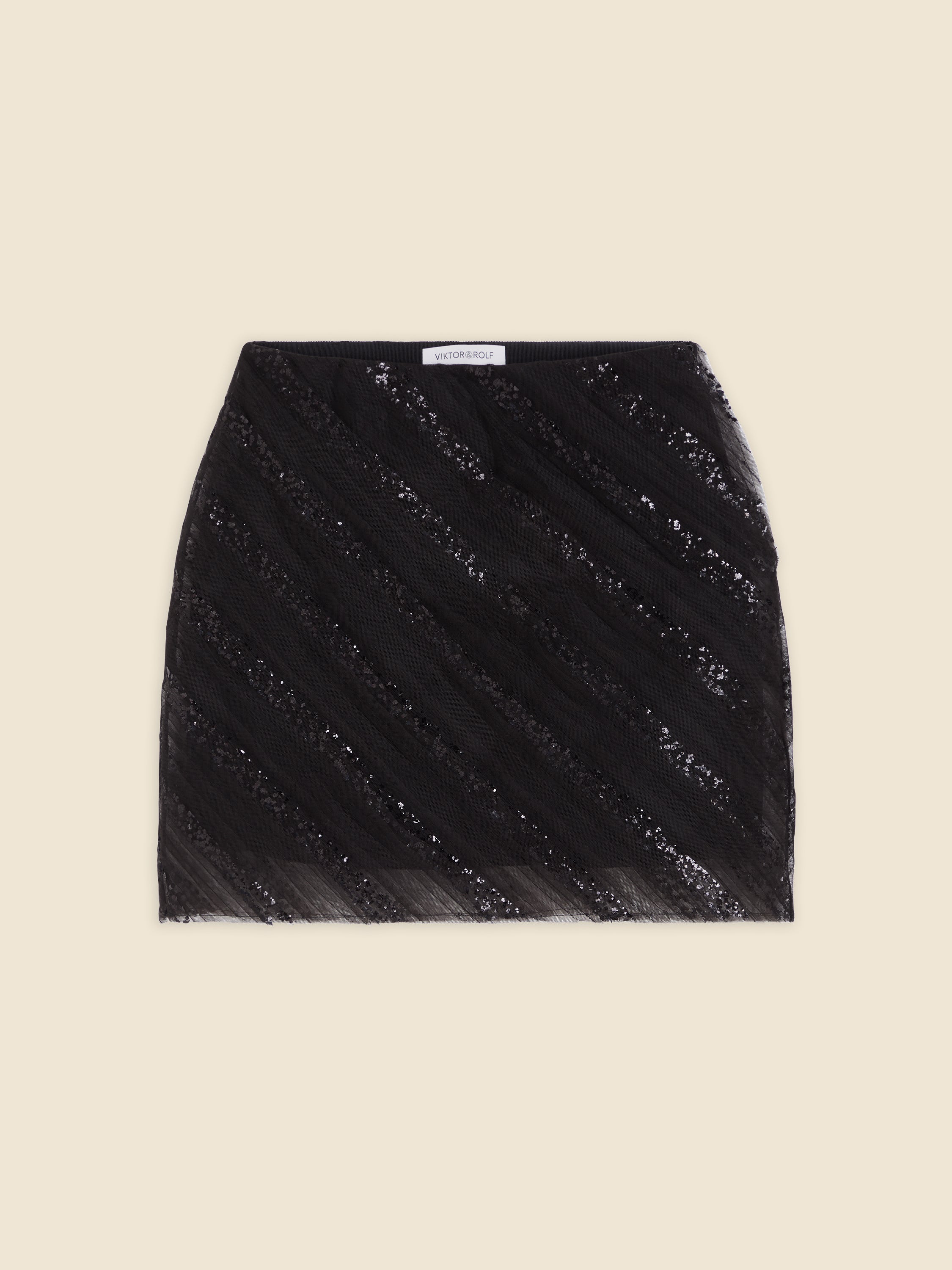 Black sequin mini skirt with diagonal striped pattern, featuring a satin blend fabric for a sleek and elegant look.