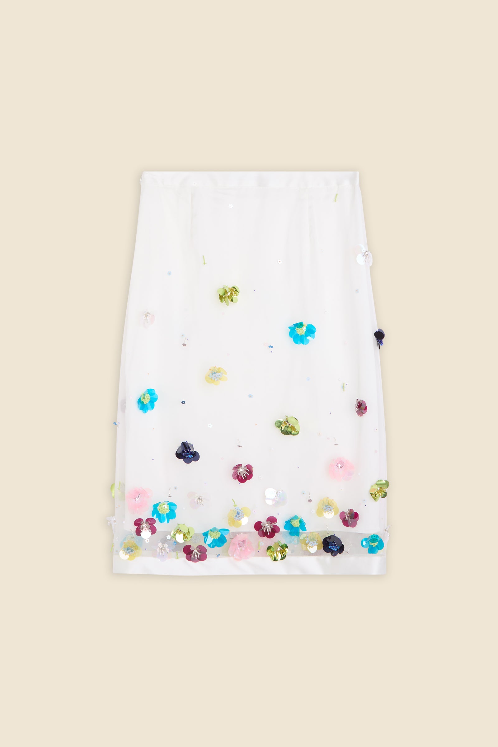 With hand-applied paillettes and crystals on silk organza featuring the satin edges, the skirt transforms classic floral embroidery into a modern piece