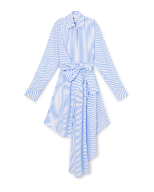 A blue and white striped shirtdress with an asymmetric hem and a large bow detail at the waist, offering a modern twist on classic style.