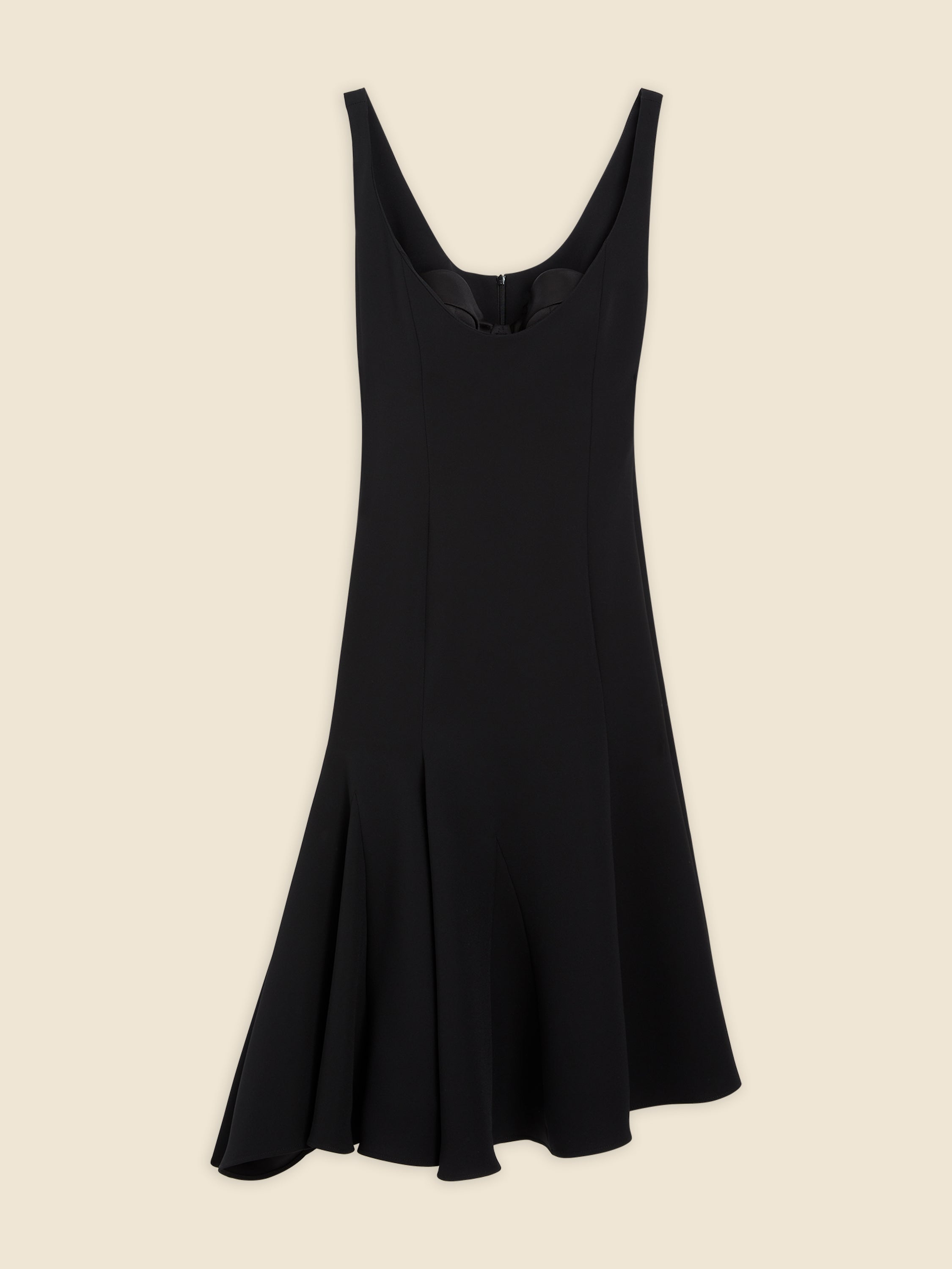 Sleeveless black dress with flared hemline, featuring a smooth, tailored crepe fabric and a subtle scooped neckline.