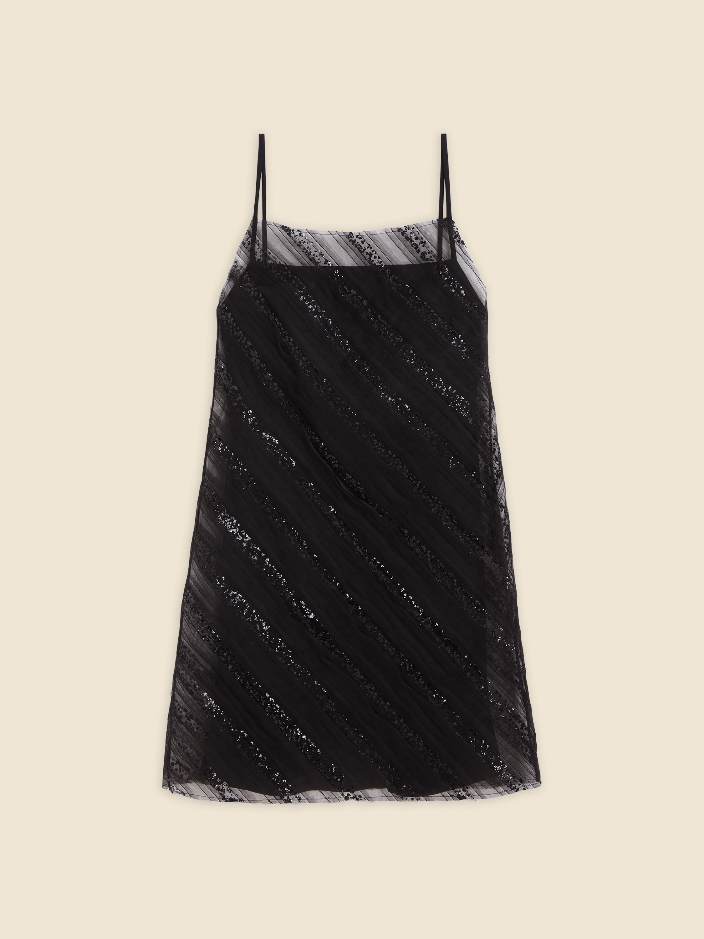 Black spaghetti strap dress with diagonal sequin stripes on sheer fabric, creating a stylish and elegant look.