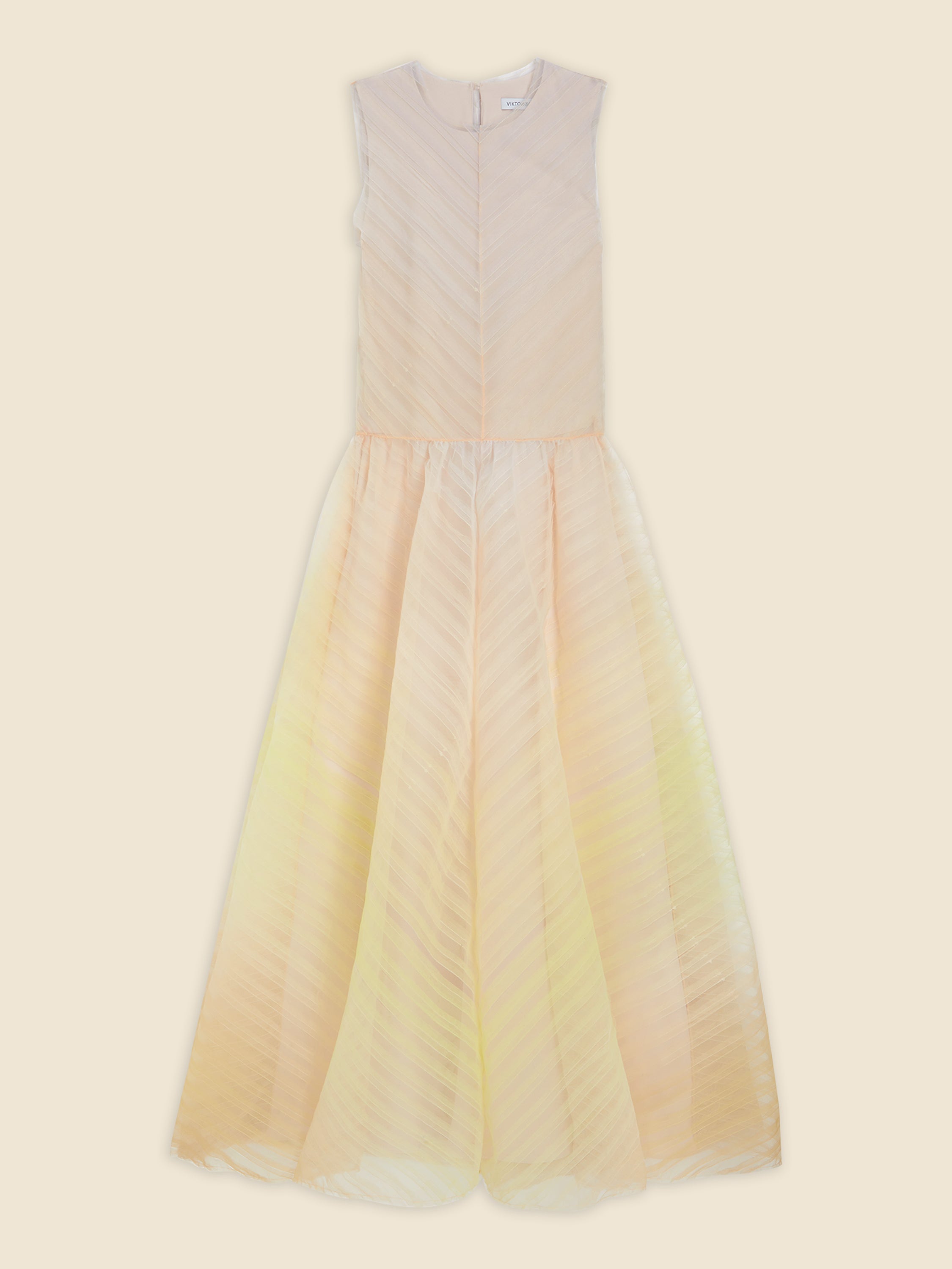 Sleeveless pastel peach chiffon dress with subtle diagonal stripes and a flowing, floor-length skirt.