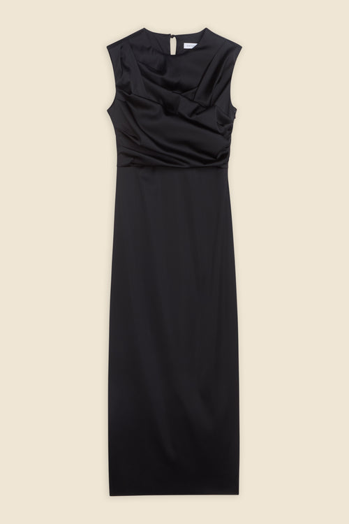 The meticulously placed pleats and stretch satin define the elegance of the dress, reflecting classic haute couture craftsmanship with a modern edge