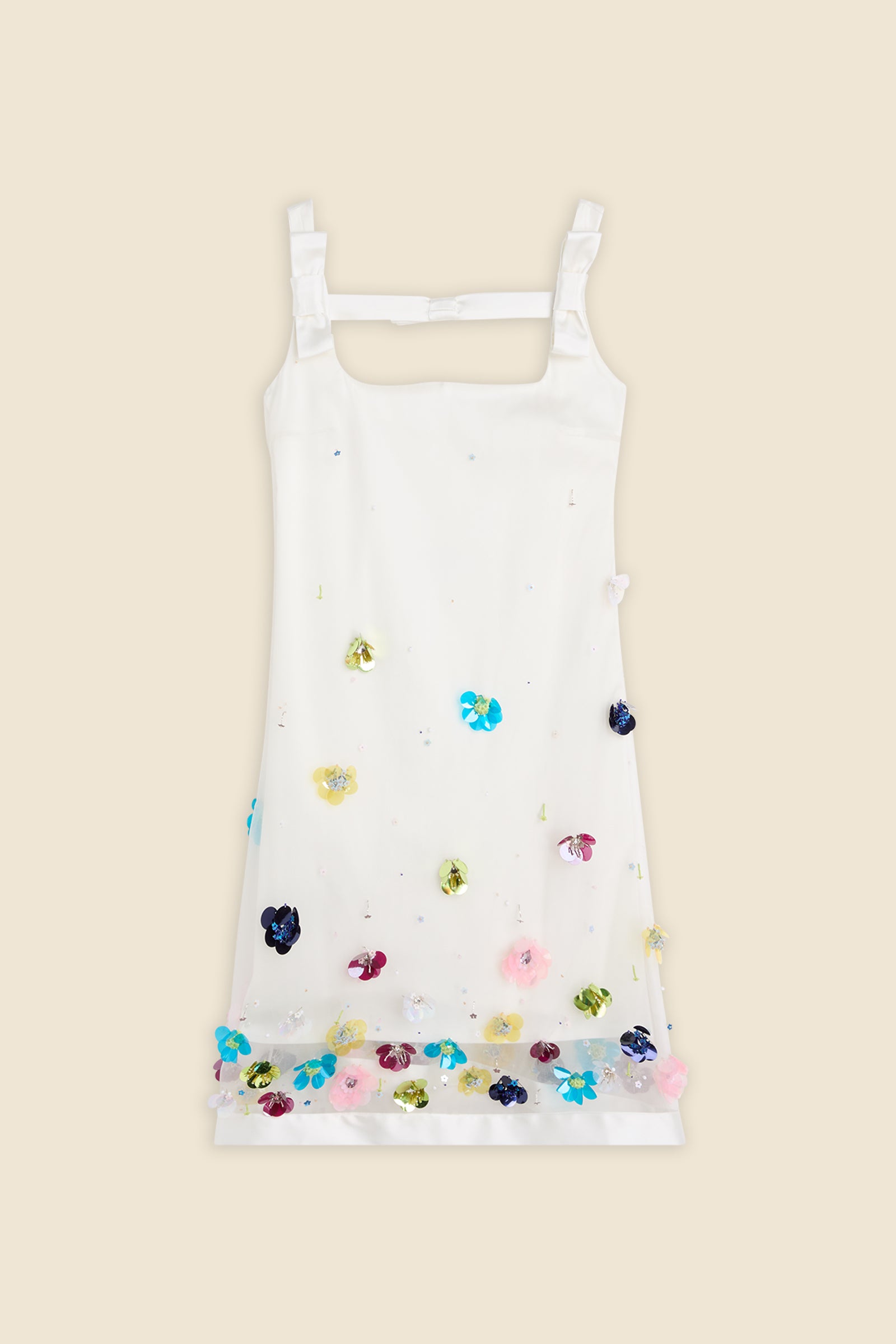 With hand-applied paillettes and crystals on silk organza featuring the satin edges, the dress transforms classic floral embroidery into a modern piece