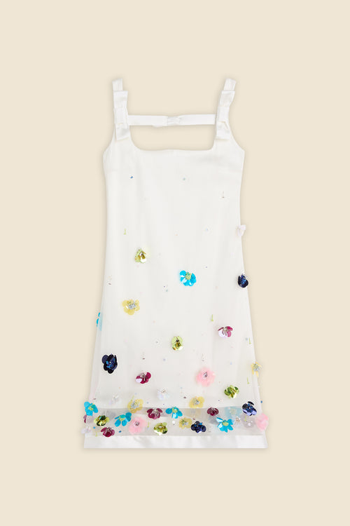 With hand-applied paillettes and crystals on silk organza featuring the satin edges, the dress transforms classic floral embroidery into a modern piece