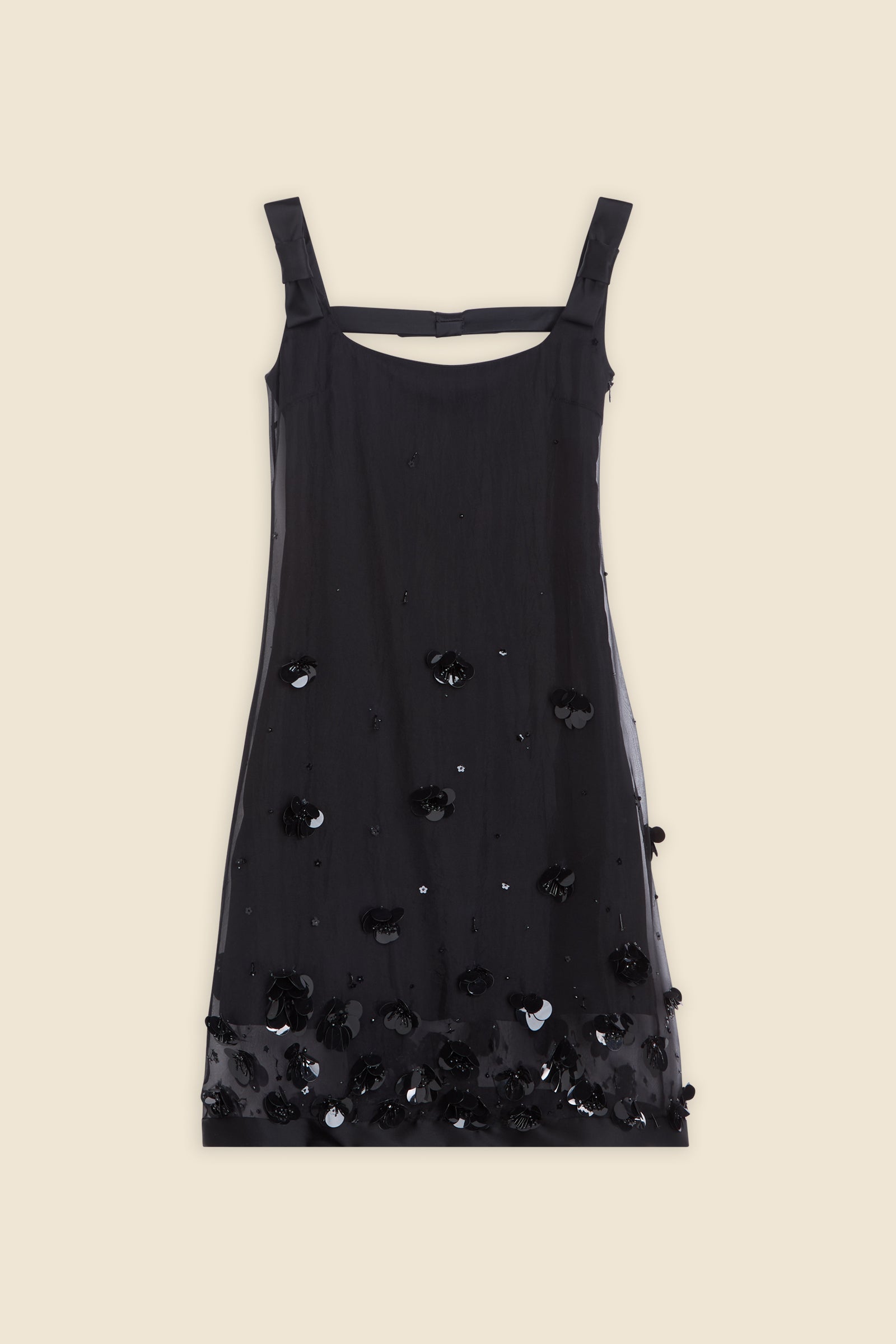 With hand-applied paillettes and crystals on silk organza featuring the satin edges, the dress transforms classic floral embroidery into a modern piece