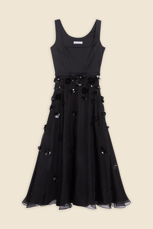 With hand-applied paillettes and crystals on silk organza featuring the satin edges, the dress transforms classic floral embroidery into a modern piece