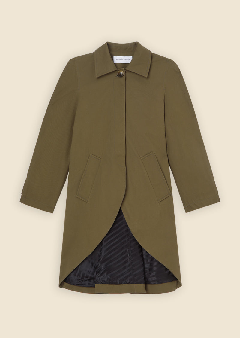 Olive green trench coat featuring a button closure, notched collar, and asymmetrical hem with a striped black lining.