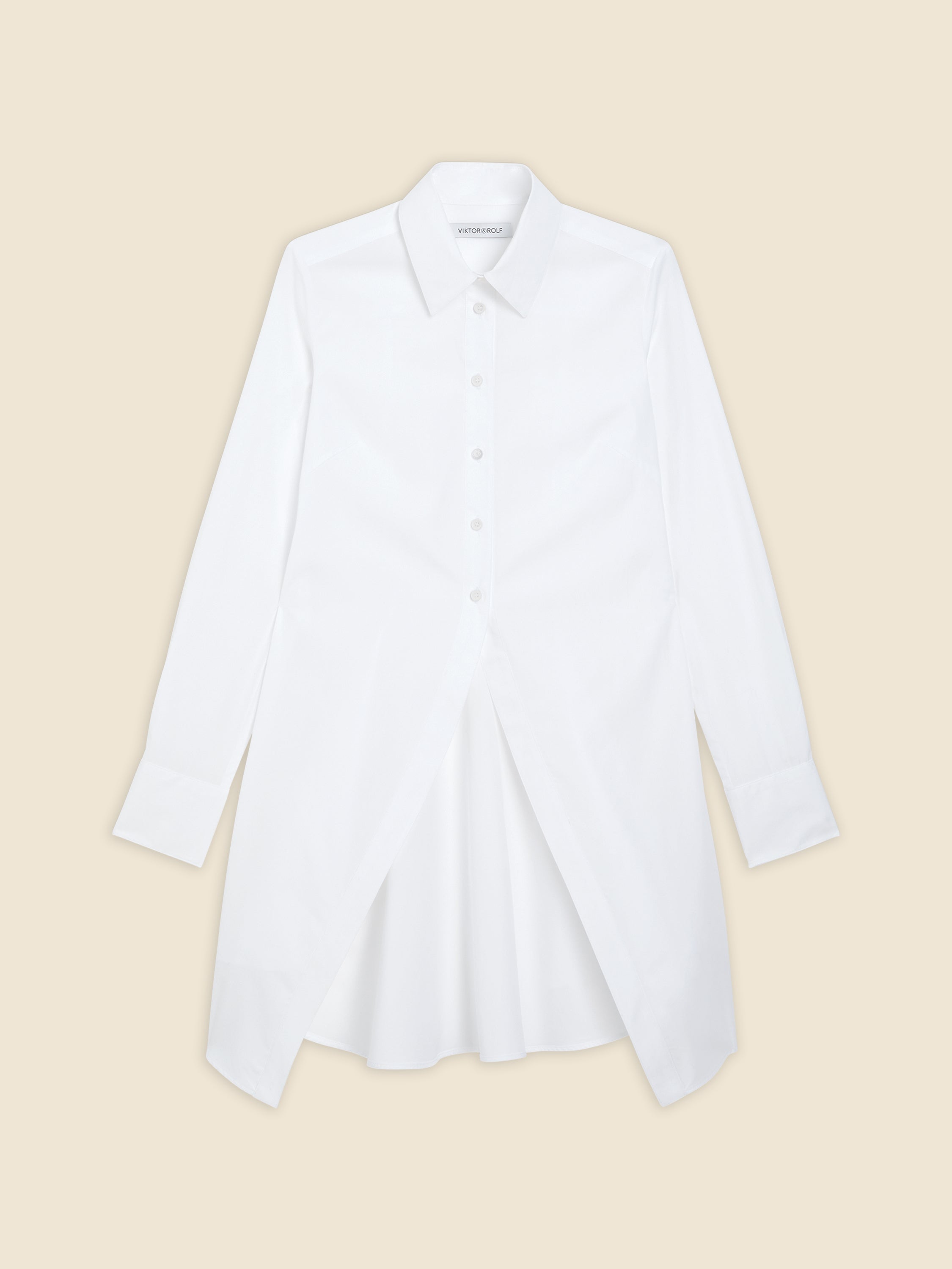 Elegant white cotton shirt dress with a structured collar and button closure, featuring a unique pleated front design.