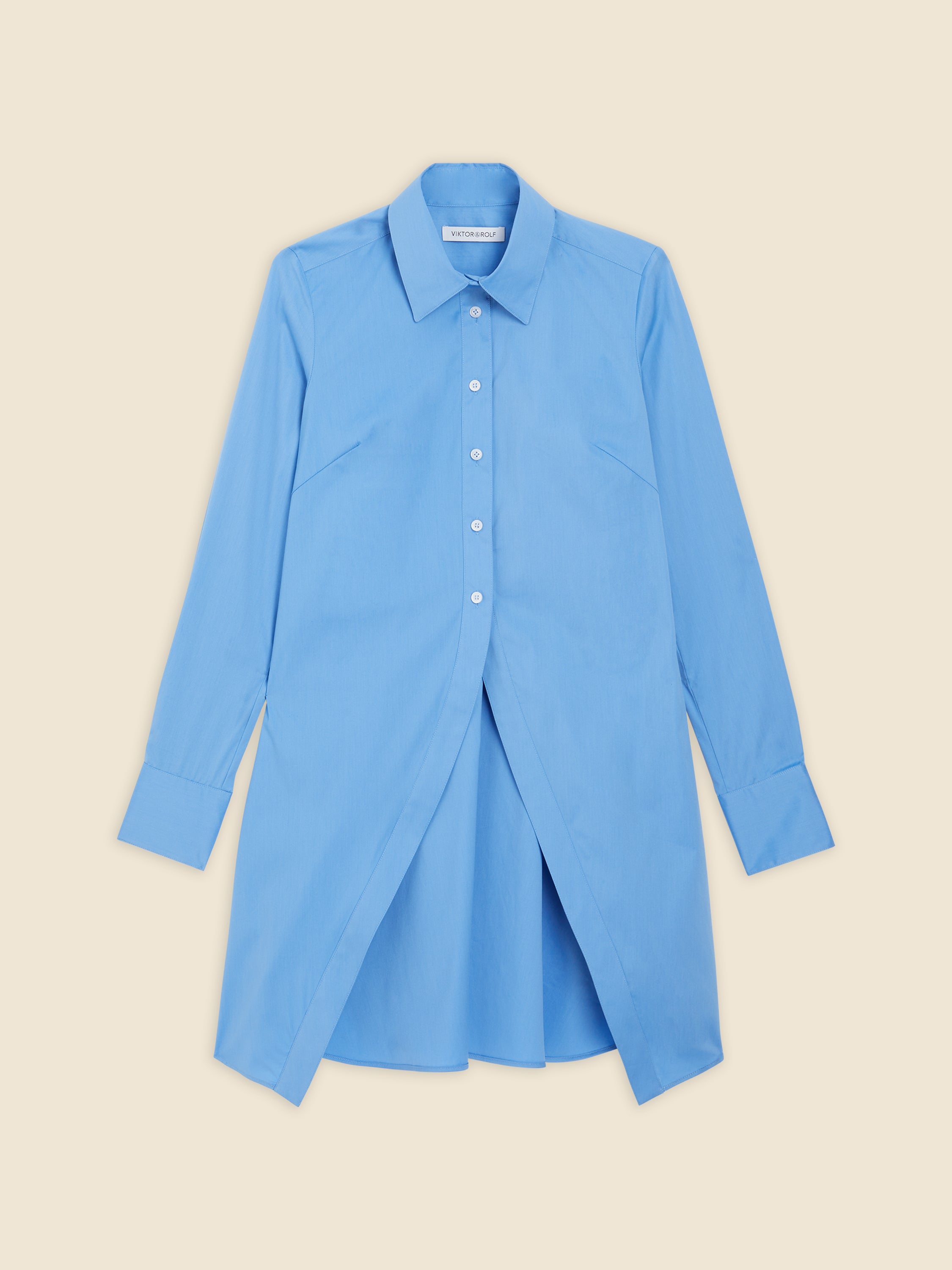 Light blue cotton shirt dress featuring a classic collar, button-down front, and unique open front slit design.