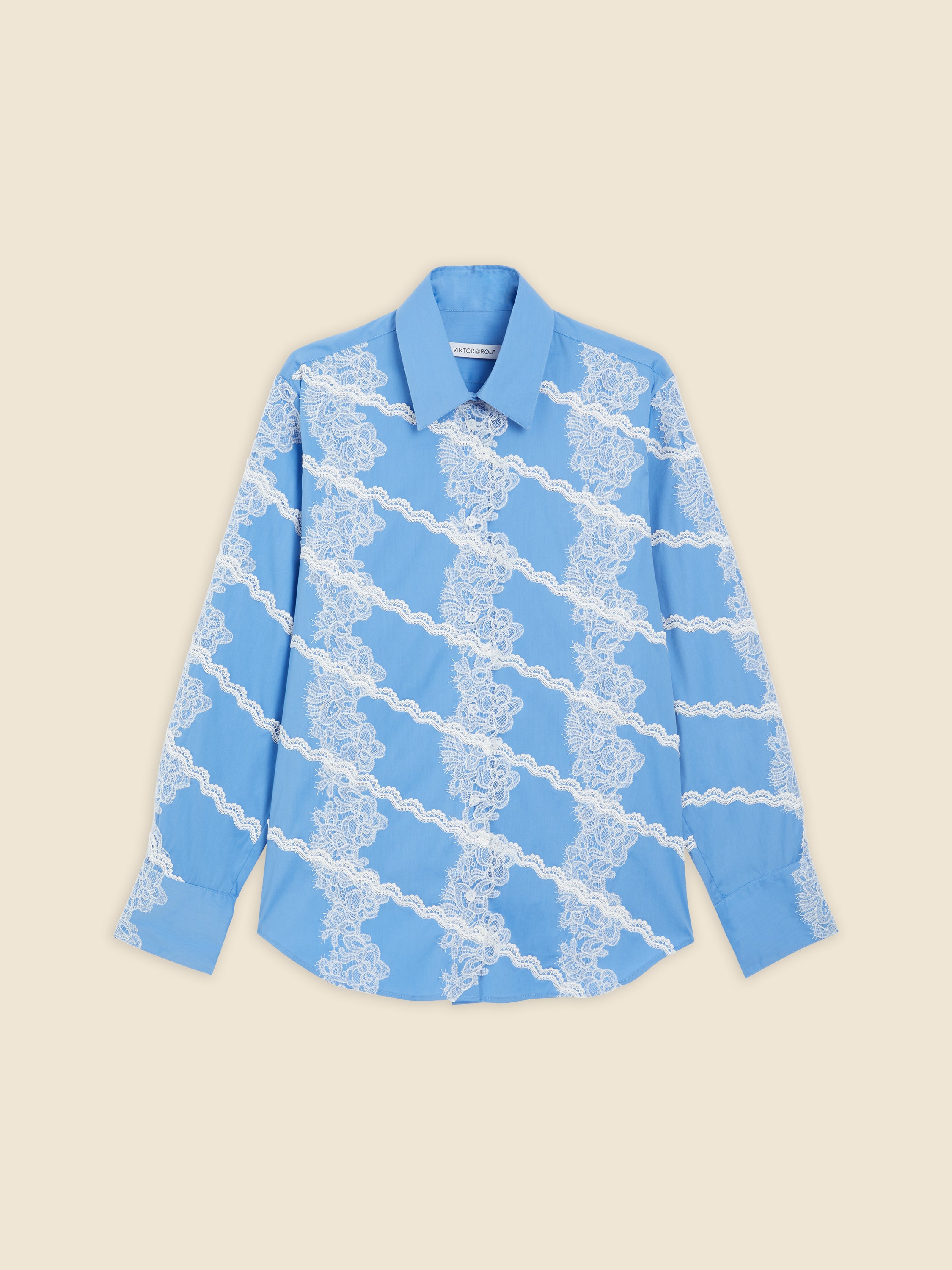 A sky-blue shirt featuring elegant white lace diagonal stripes, providing a chic contrast and delicate floral pattern.