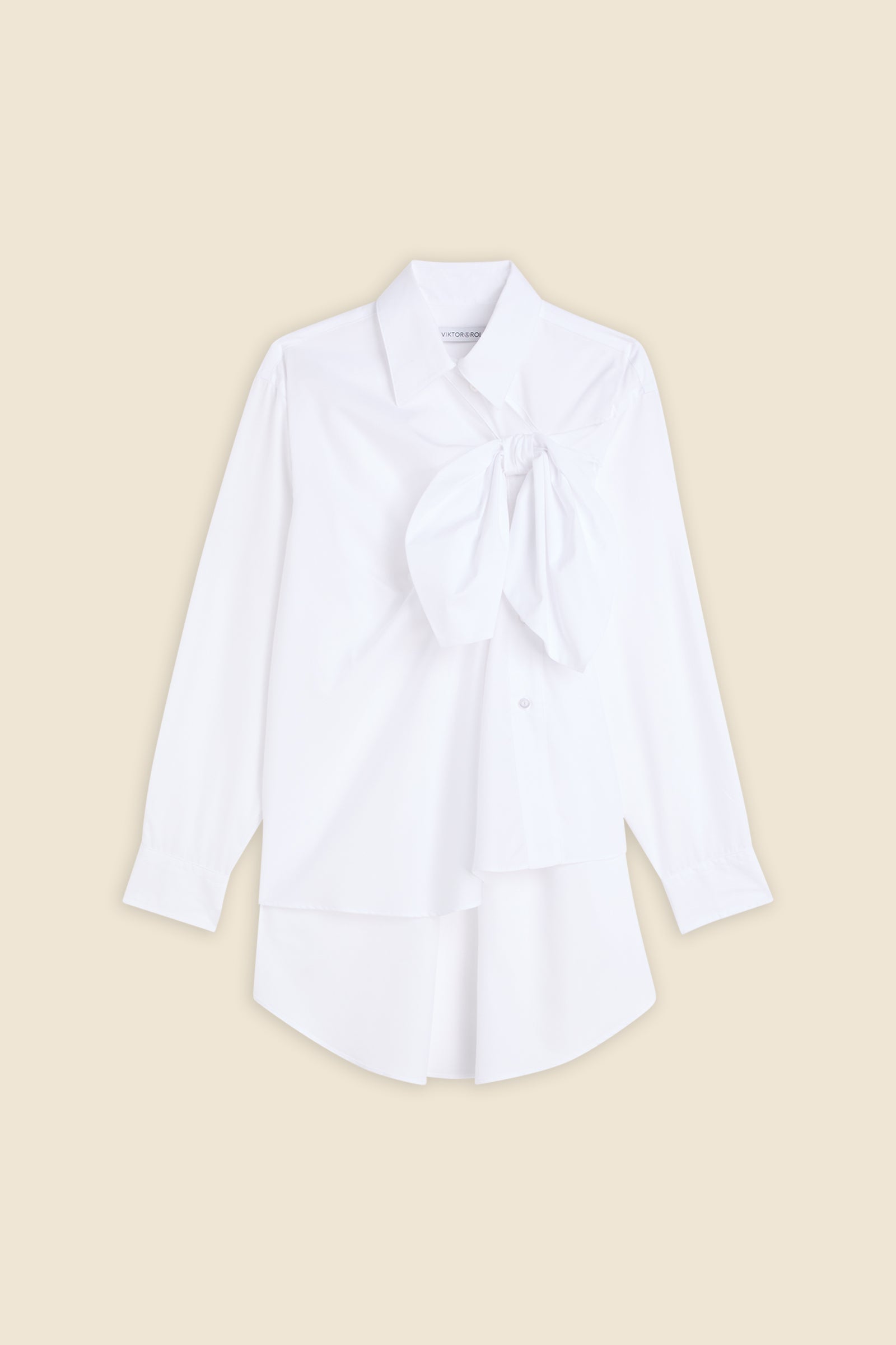 Drawing from viktor&rolf’s haute couture ‘red carpet’ collection, the shirt transforms traditional menswear patterns into a feminine, glamorous silhouette