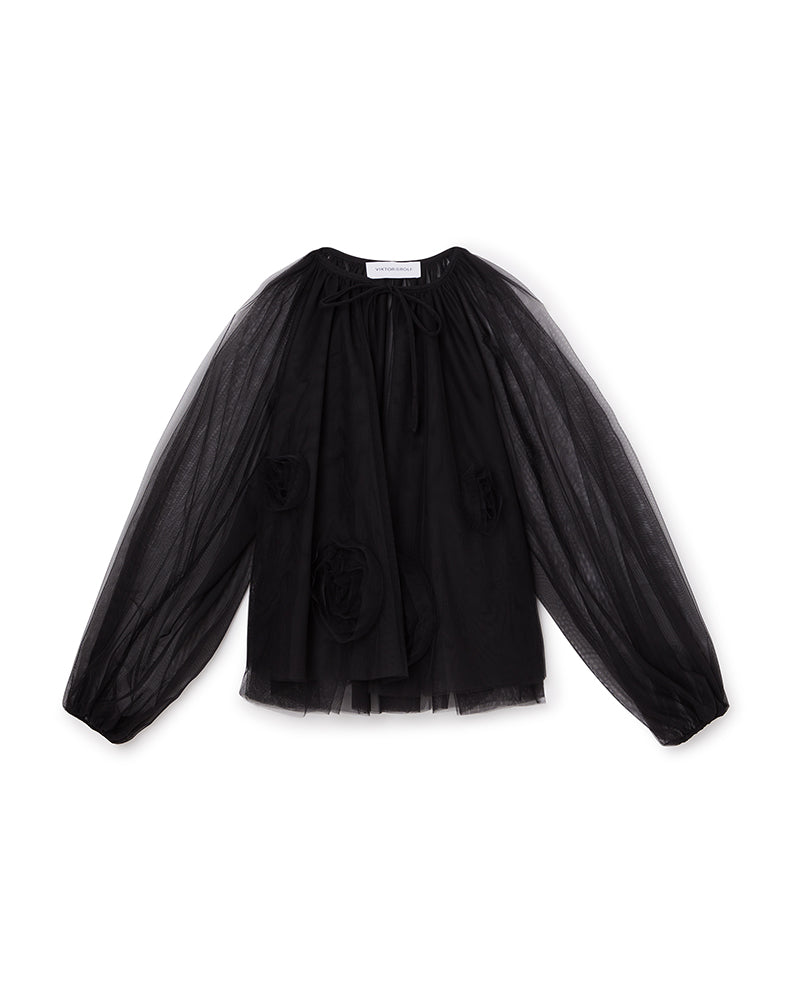 Sheer black tulle blouse with voluminous sleeves and detailed appliqué accents, offering a dramatic and elegant look.