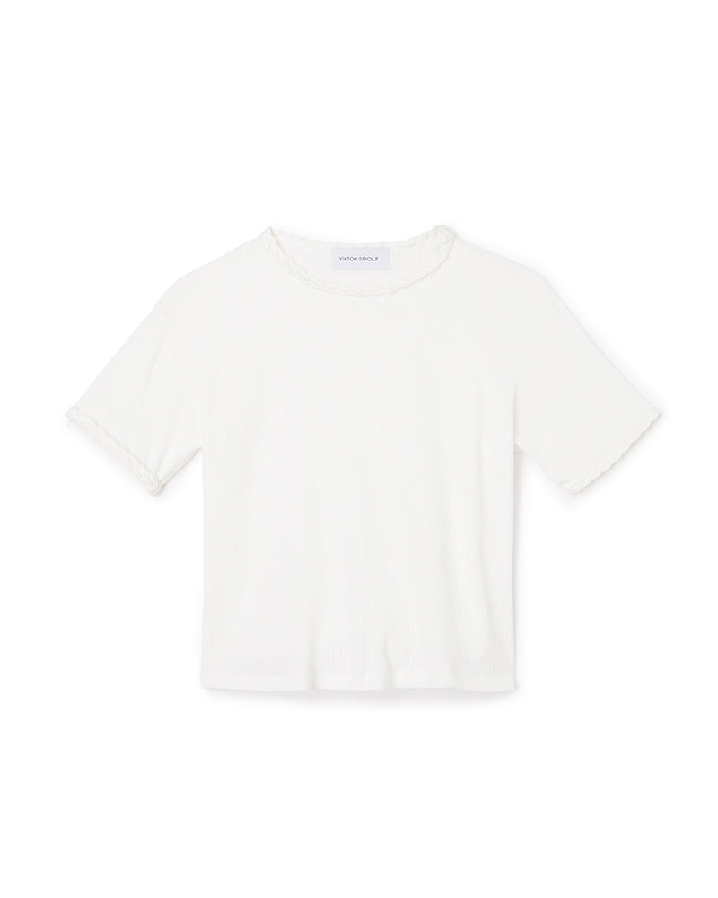 Short-sleeve ivory ribbed cotton t-shirt with subtle ruffle accents on the hem and neckline, featuring a classic slim fit design.
