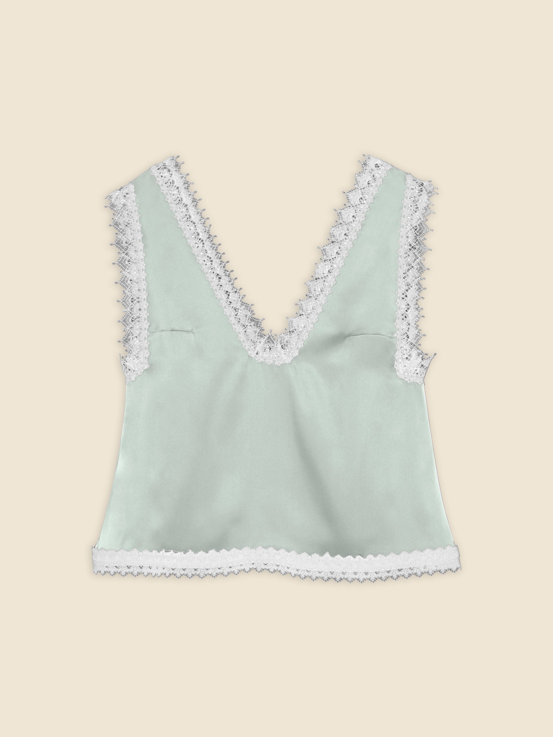 Mint green satin top with intricate white lace trim, featuring a deep V-neckline and a delicate scalloped edge.