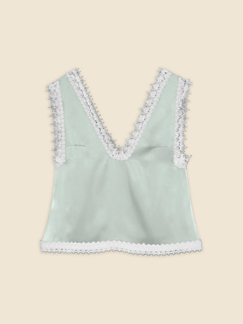 Mint green satin top with intricate white lace trim, featuring a deep V-neckline and a delicate scalloped edge.