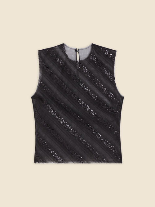 Sleeveless black sequined top with diagonal stripes on a cream background, featuring a back button closure.