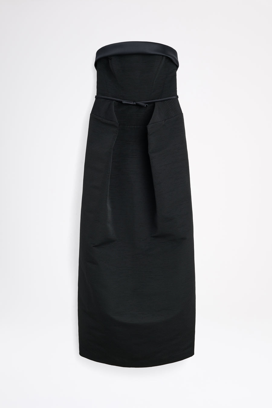 Black dress with a bow detail on a white background