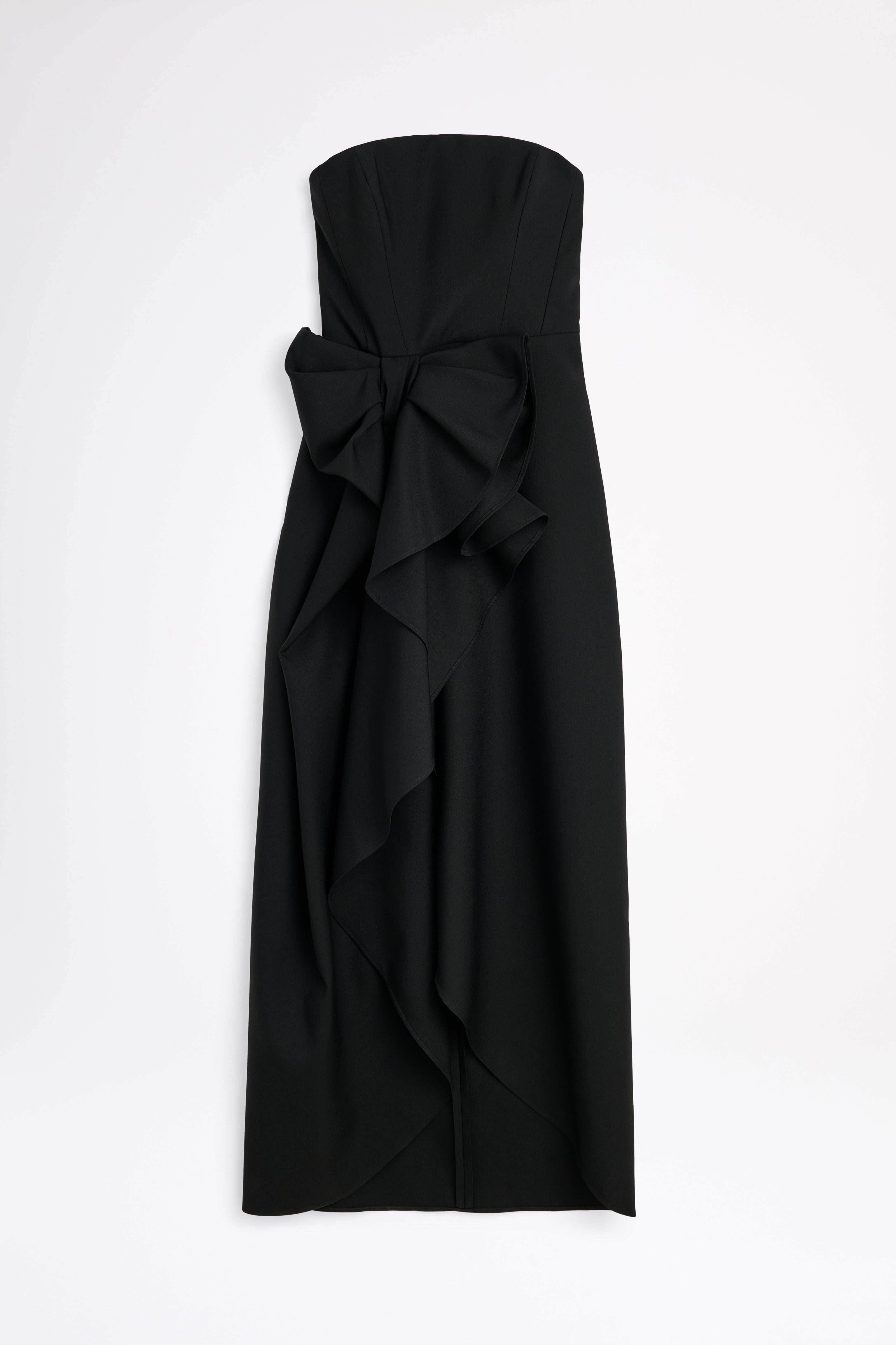 Black strapless dress with a large bow on a white background