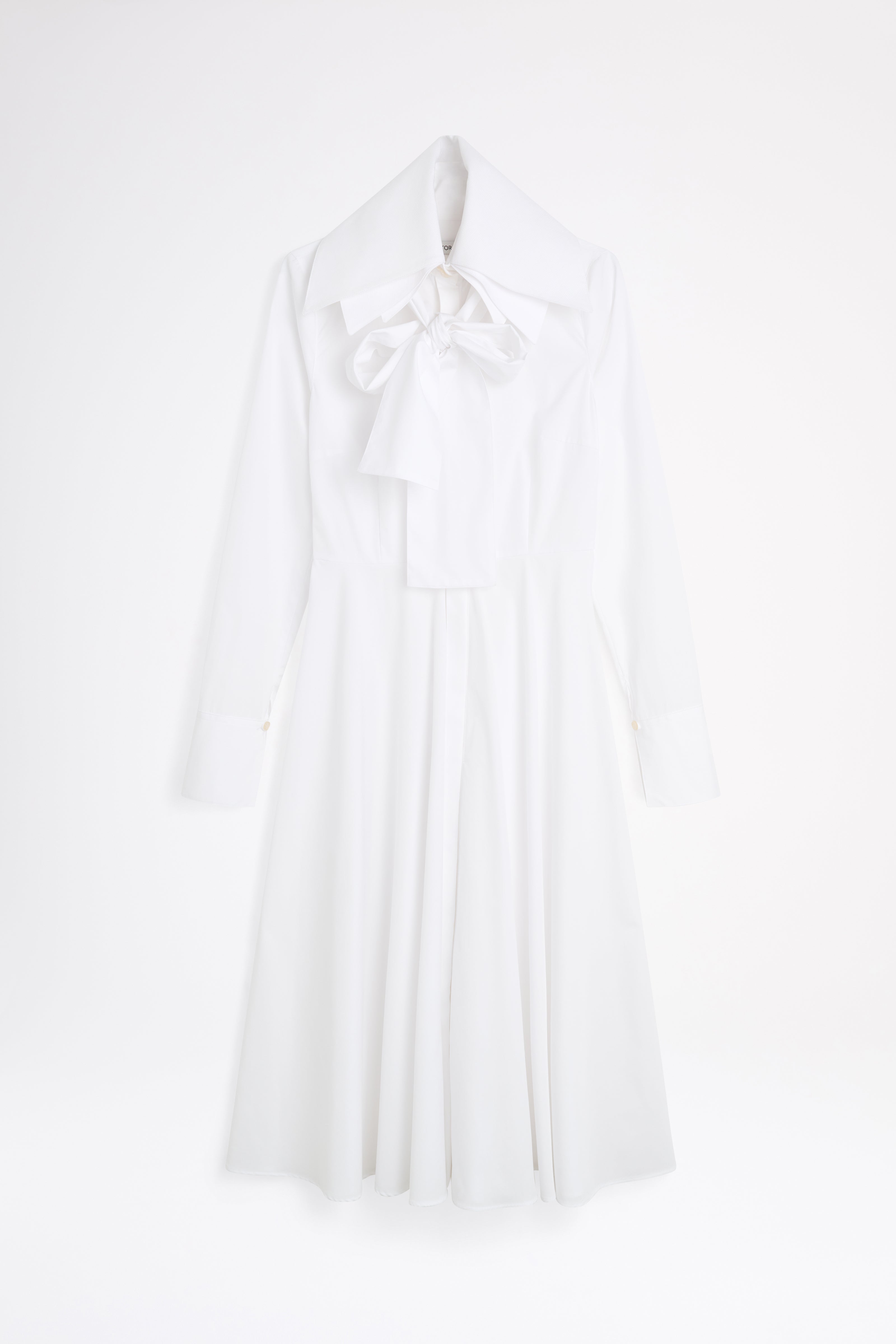 White halter neck dress on a light gray background