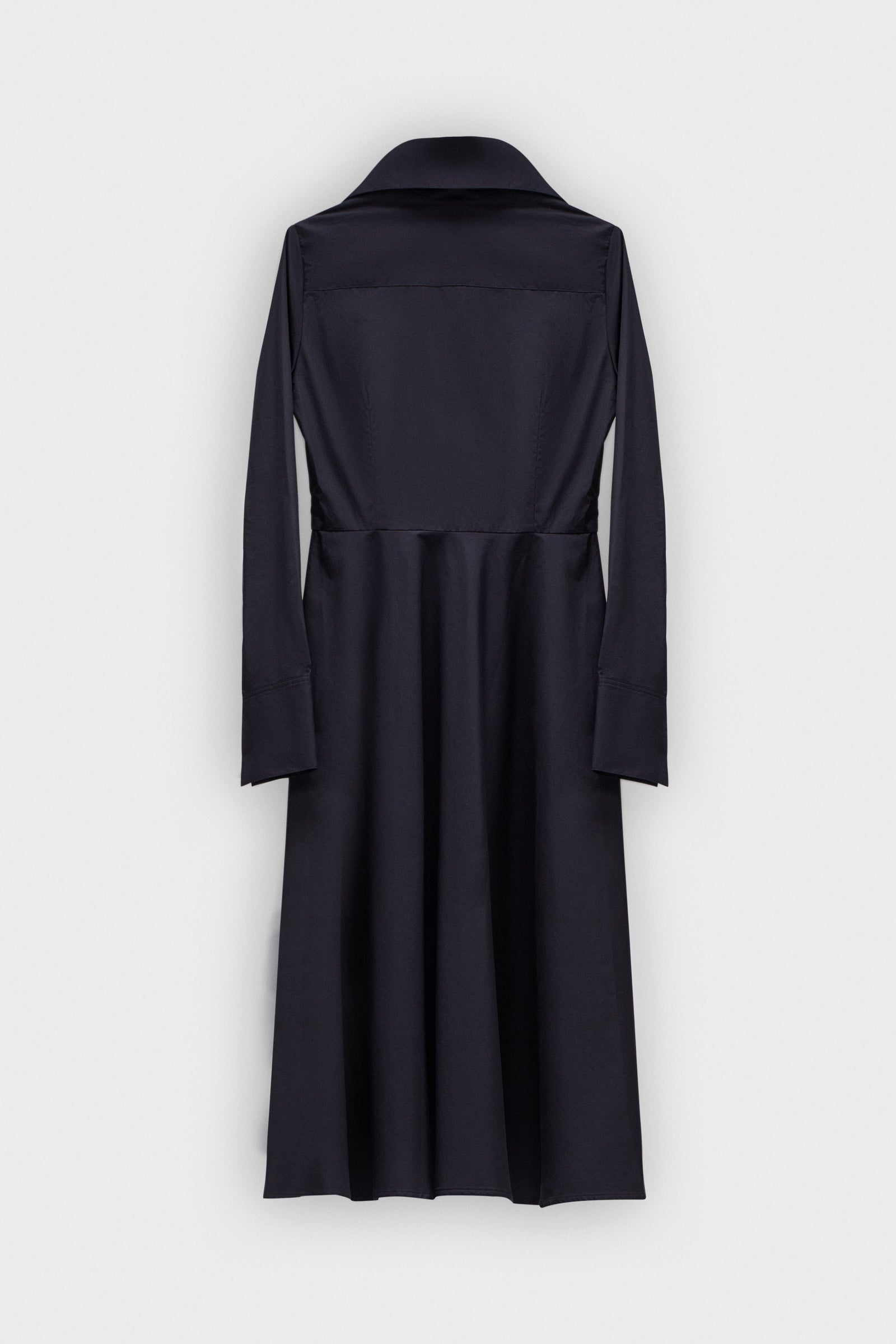 A long black dress with a multi-layer collar and a bow detail on a white background.