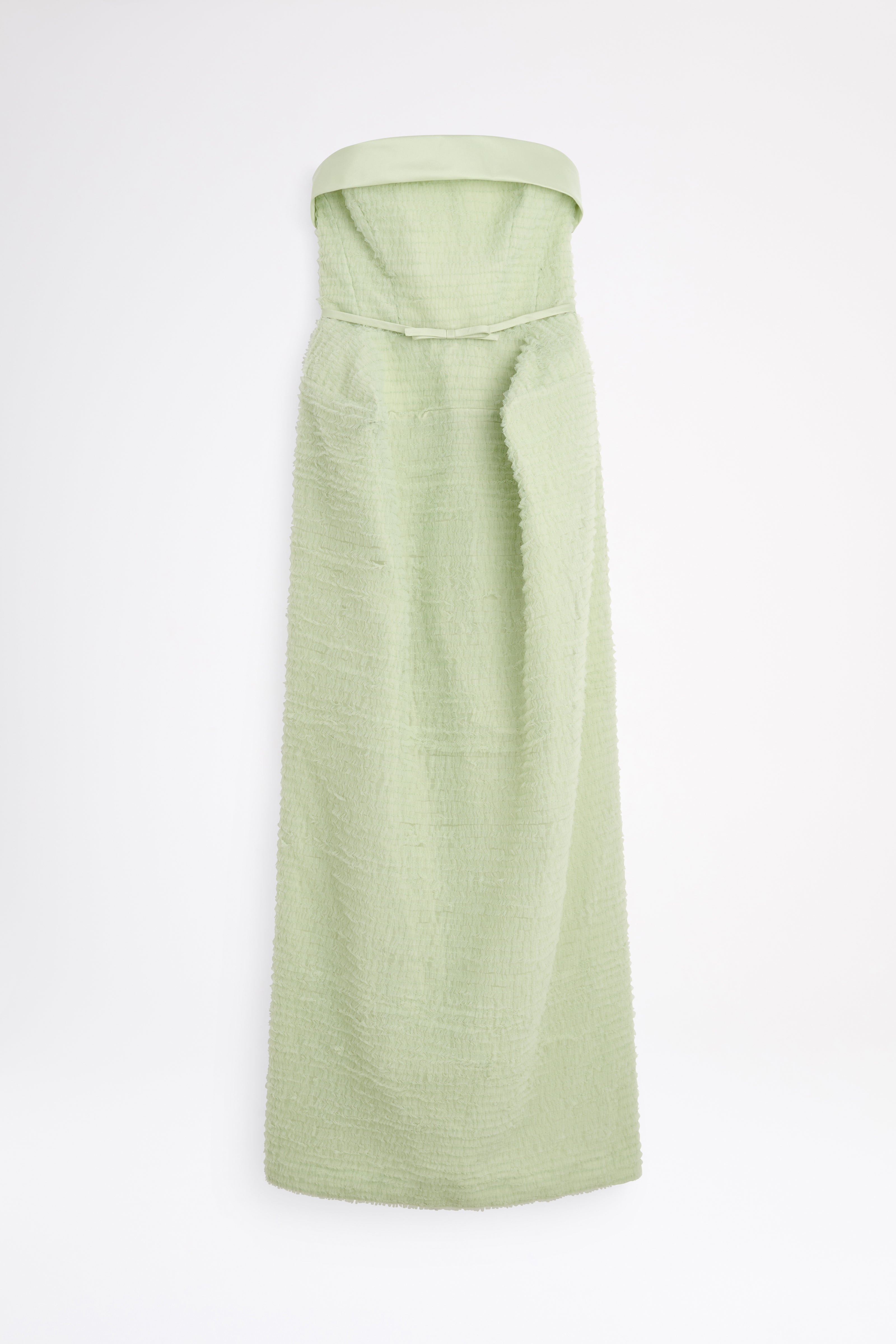 Light green dress with a belt on a white background