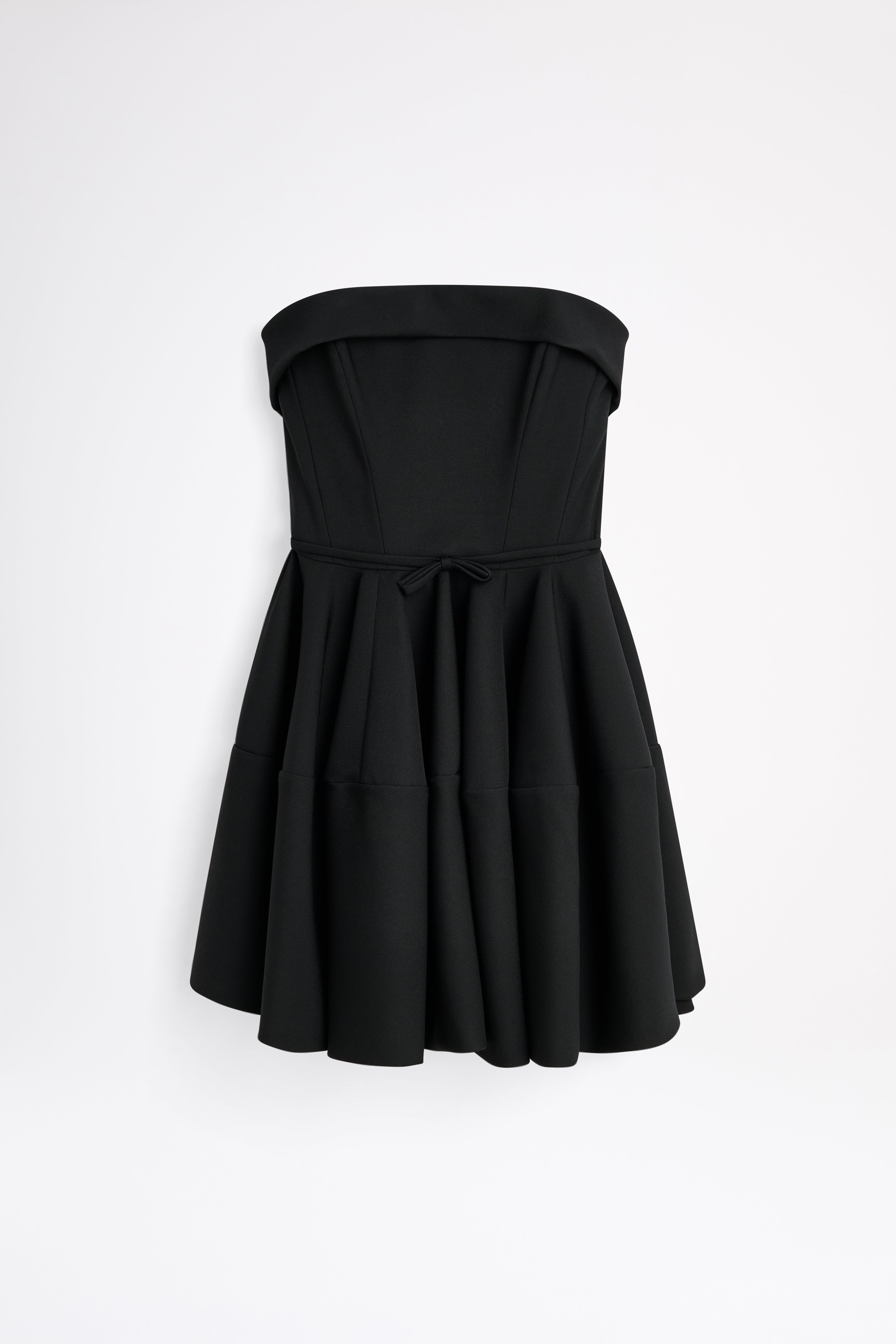 Black strapless dress on a white background