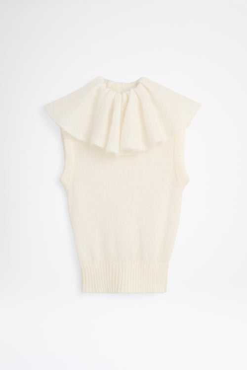 White volant neck top.