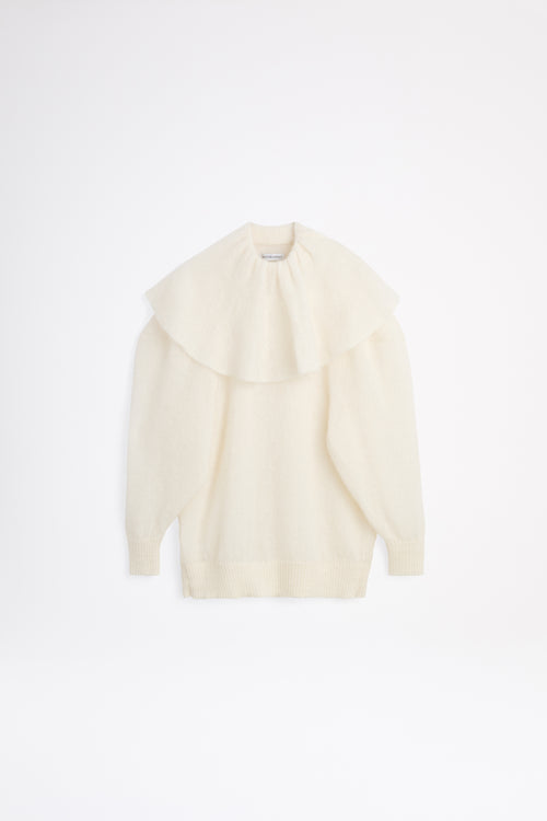 White volant neck sweater.