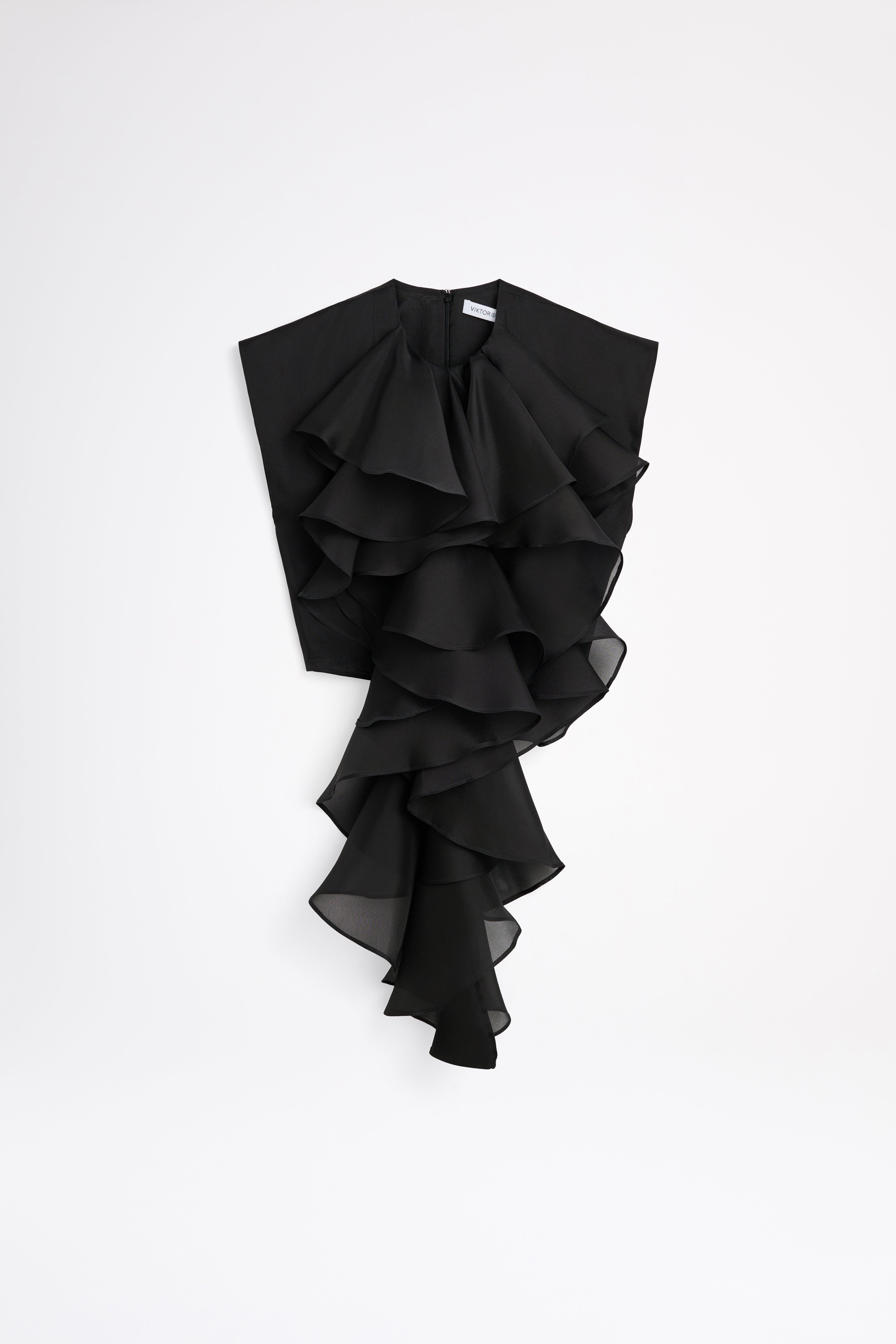 Black ruffled garment on a white background
