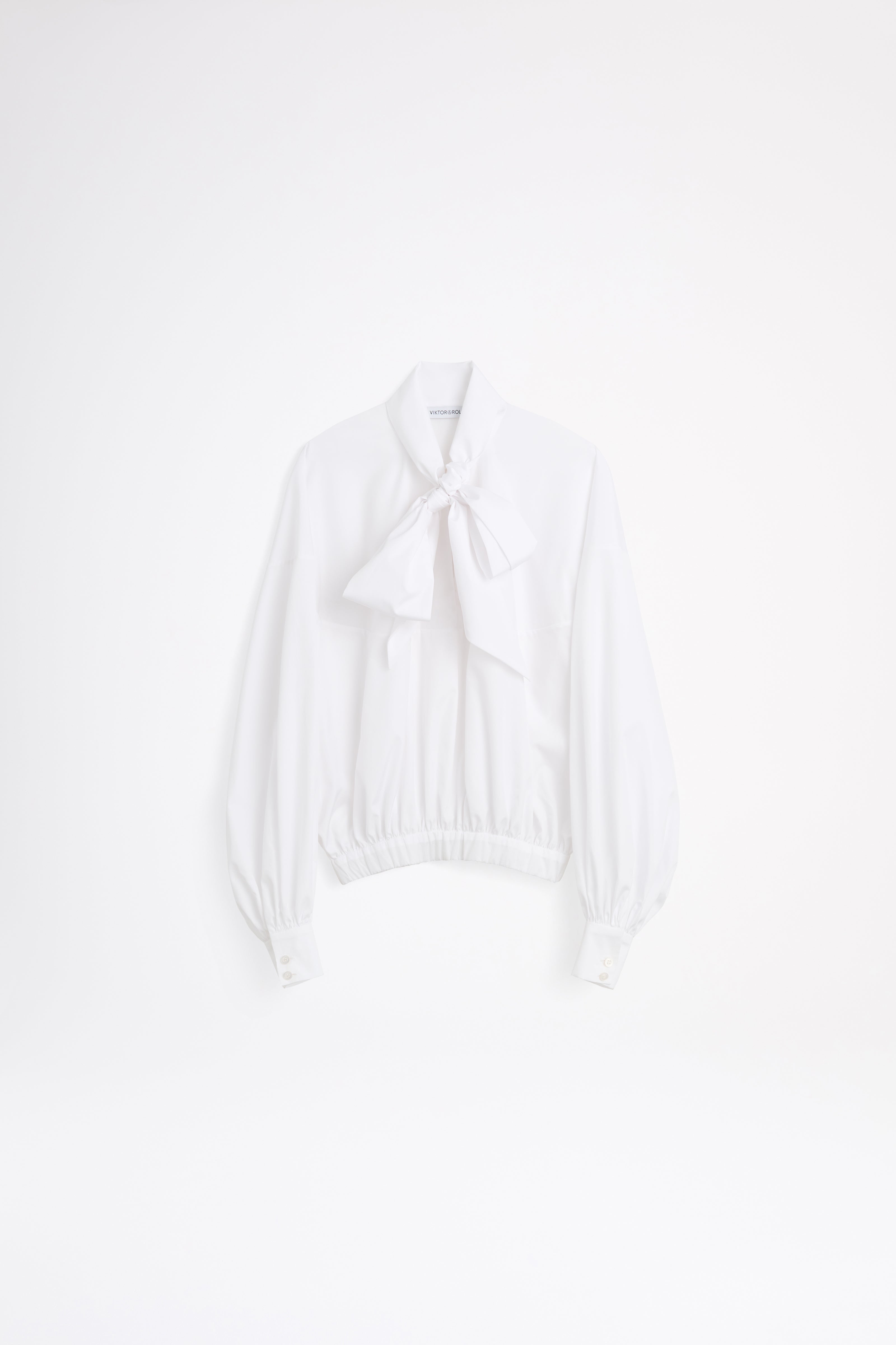 White bikini top on a light gray background