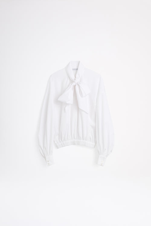 White bikini top on a light gray background