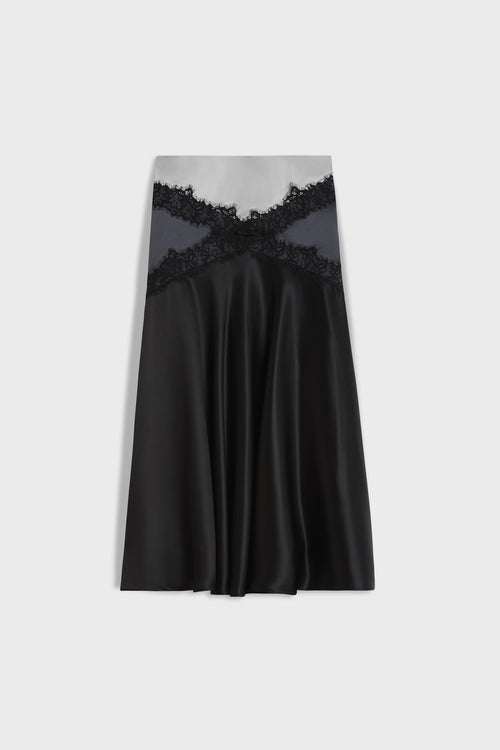 A black satin A-line skirt featuring a sheer dark gray mesh band across the waist with a black lace criss-cross overlay, shown against a light gray background.