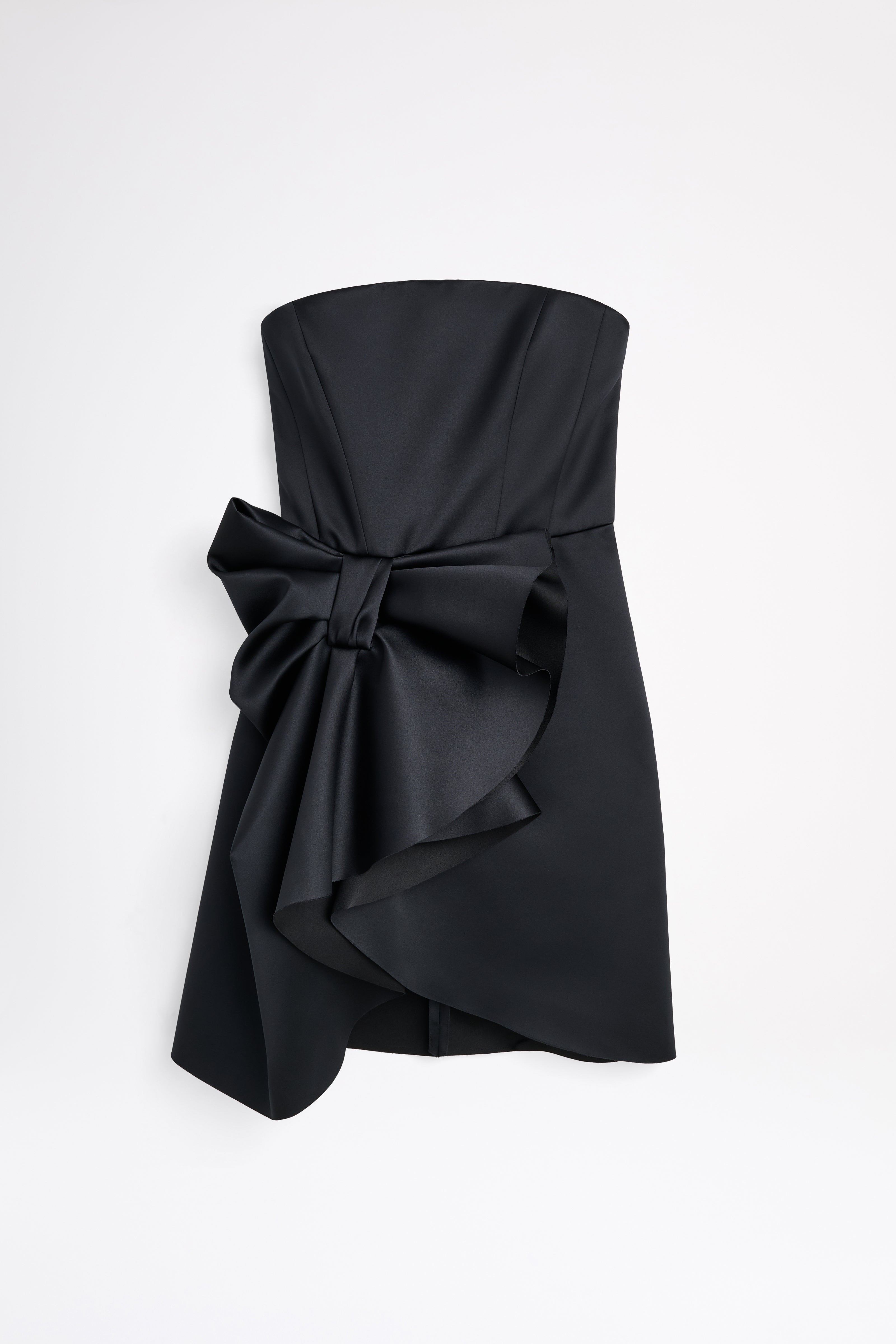 Mini black dress on a white background.