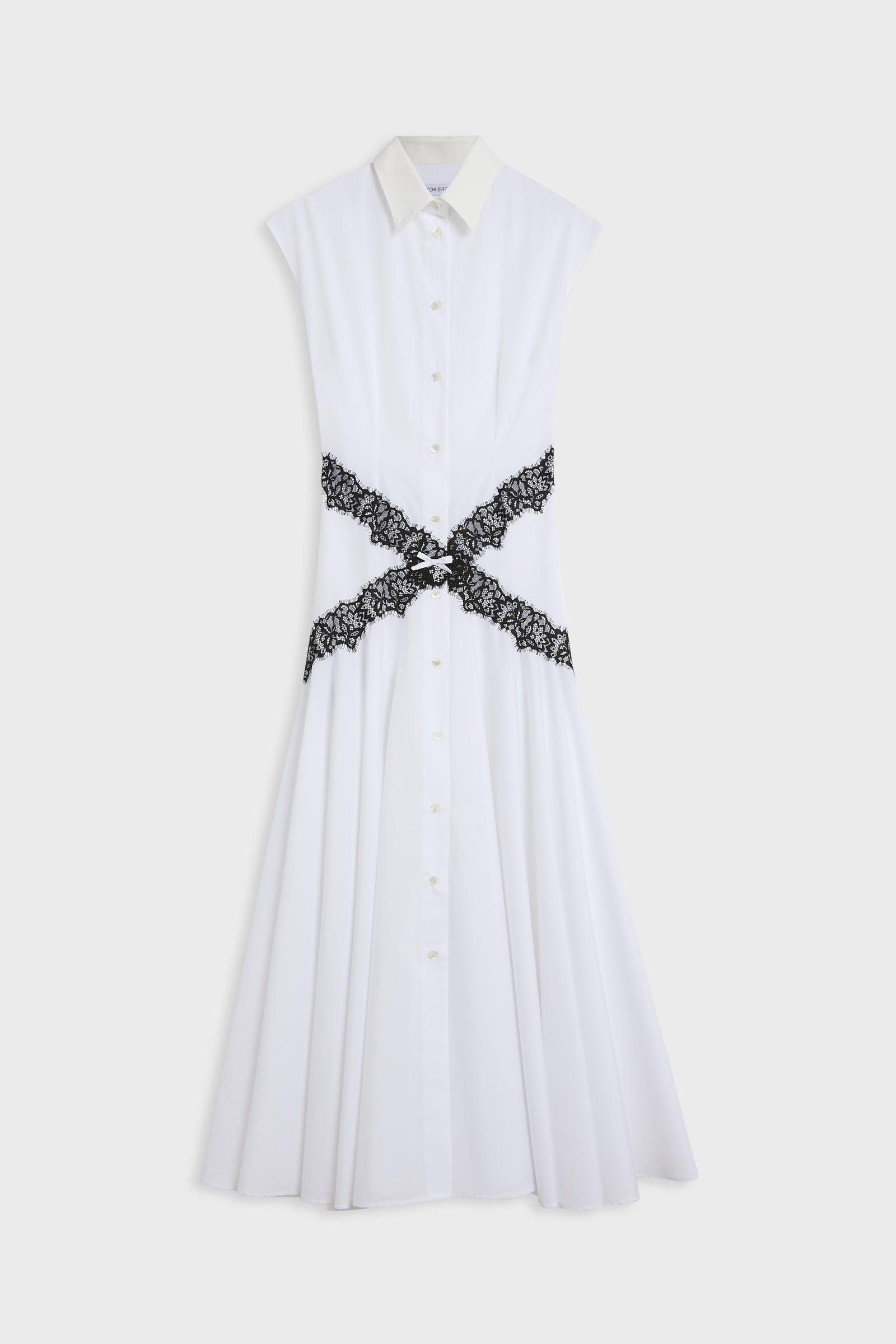 A white sleeveless collared shirt dress with a button-front bodice and a black lace cross-belt detail at the waist, shown against a light gray background.