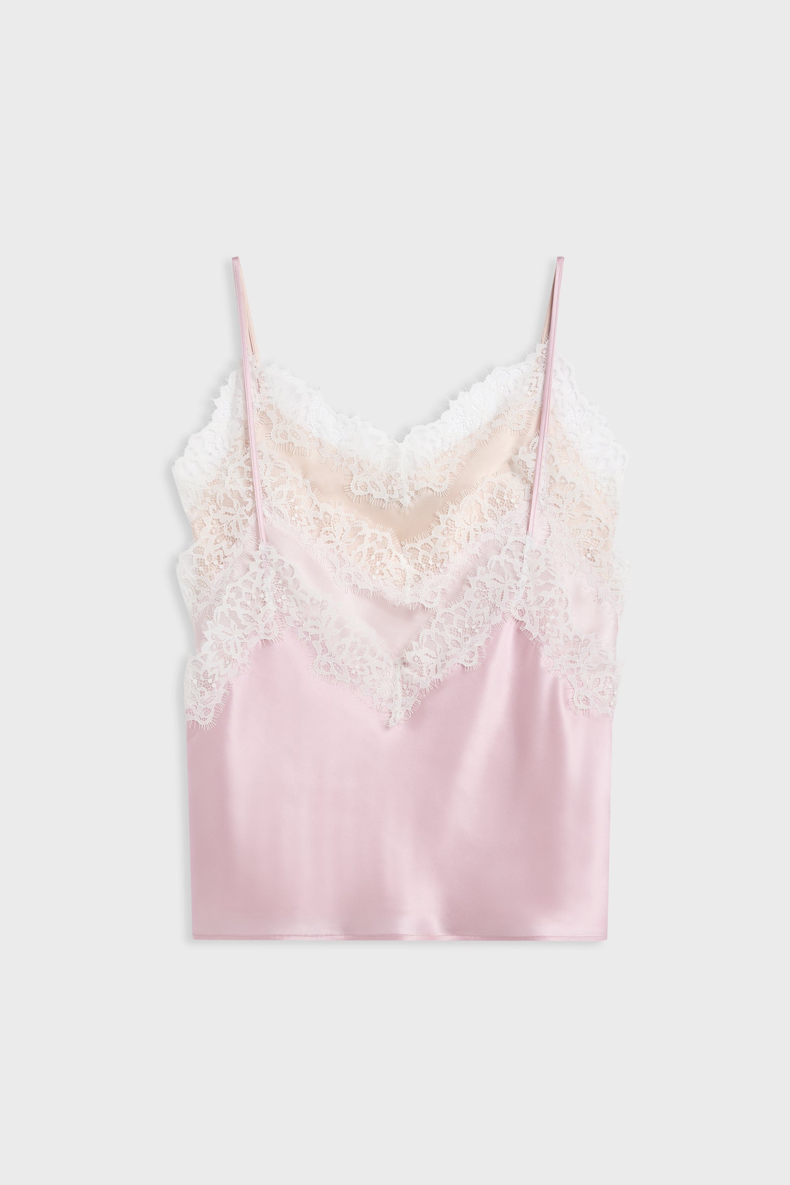 A light pink satin camisole top with white lace trim along the neckline and thin spaghetti straps, displayed flat against a light gray background.