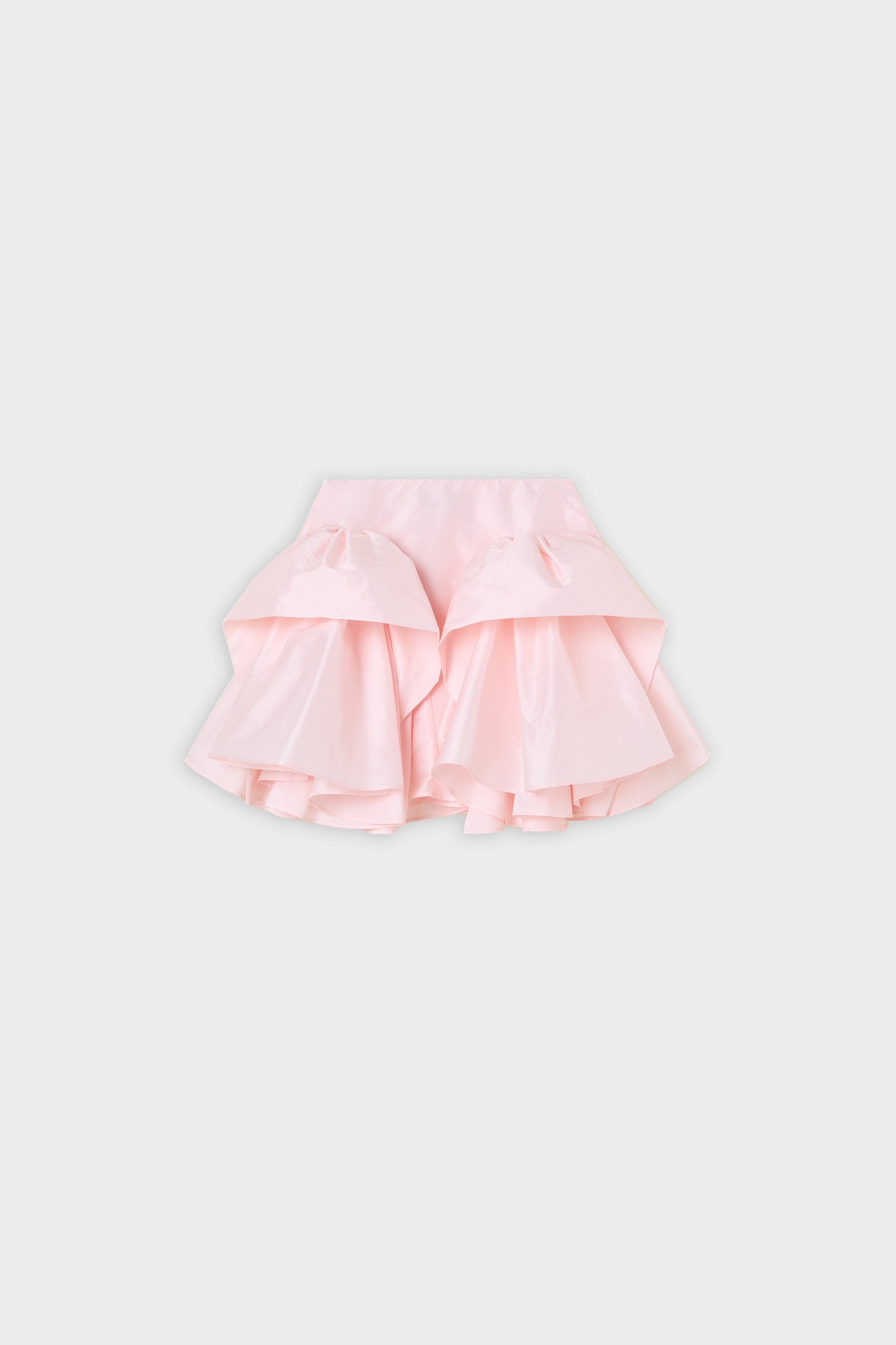 Pink ruffled skirt on a white background.