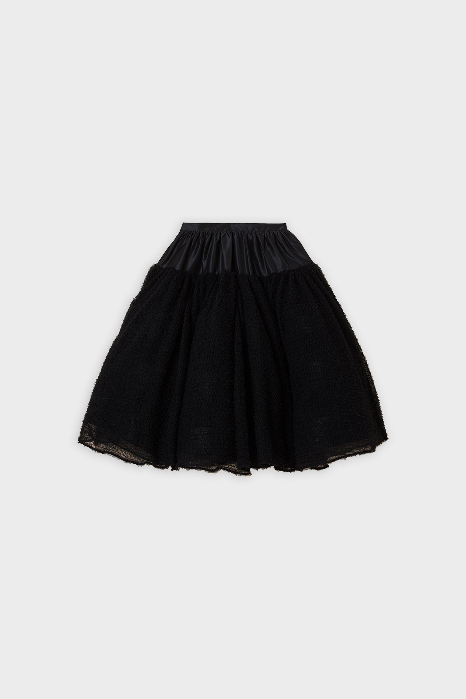 Black tulle skirt on a white background.