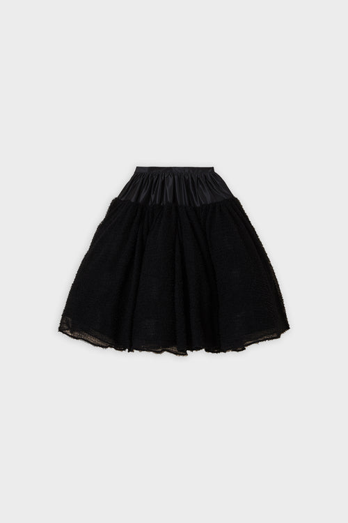 Black tulle skirt on a white background.