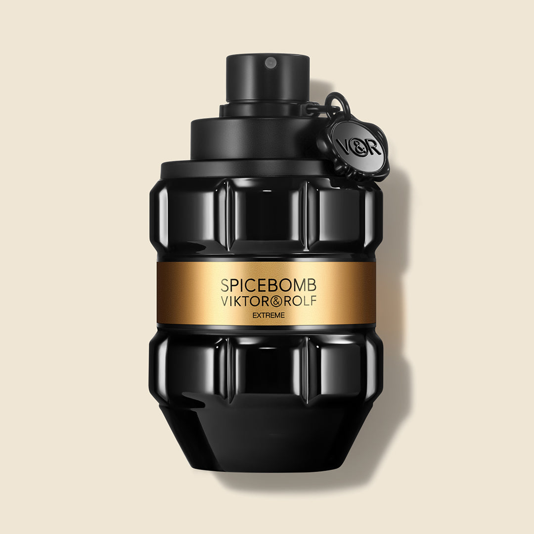 Grenade-shaped bottle of Spicebomb Extreme by Viktor & Rolf, a bold fragrance for men, with sleek black and gold design.