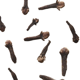 Photo of cloves on a white background.